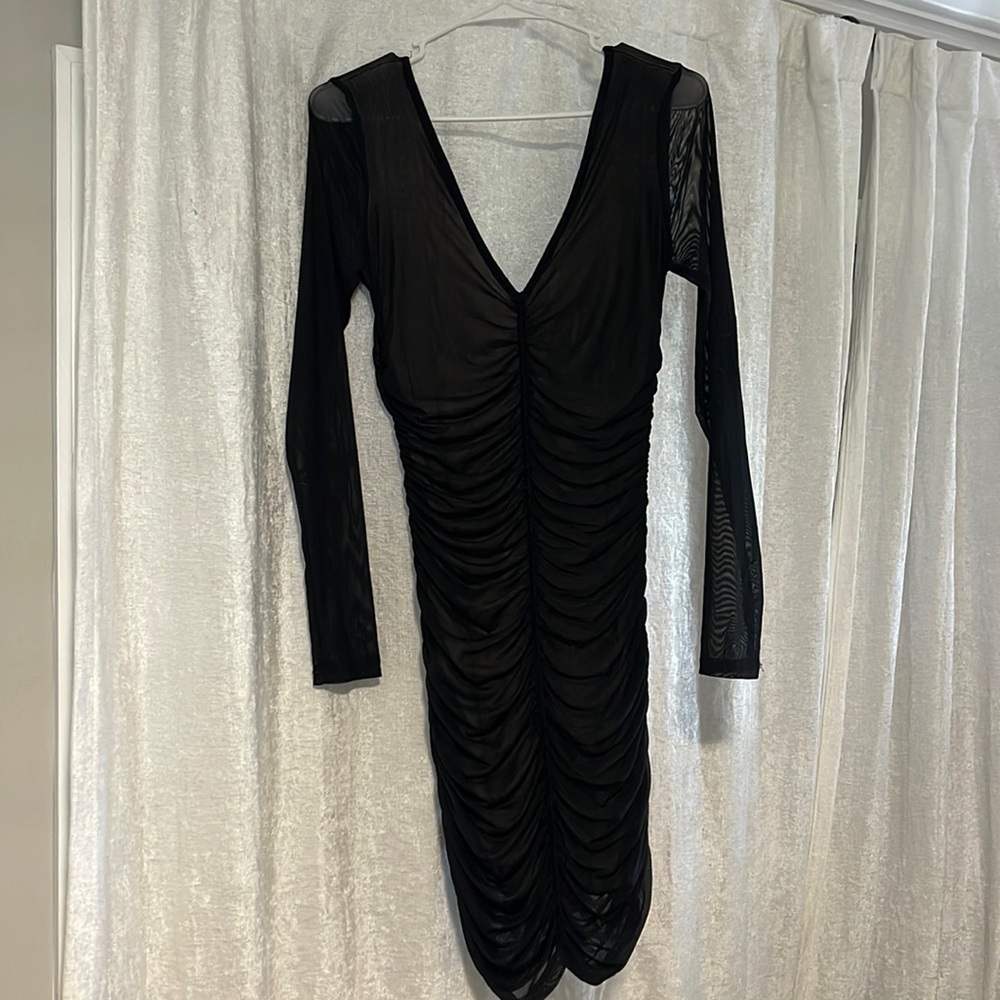 Sheer black cocktail dress with nude underlay. Stretchy, size Large. NWT.